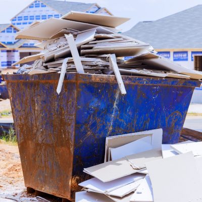 During,Construction,,Metal,Containers,Serve,As,Dumpsters,For,Collecting,Waste